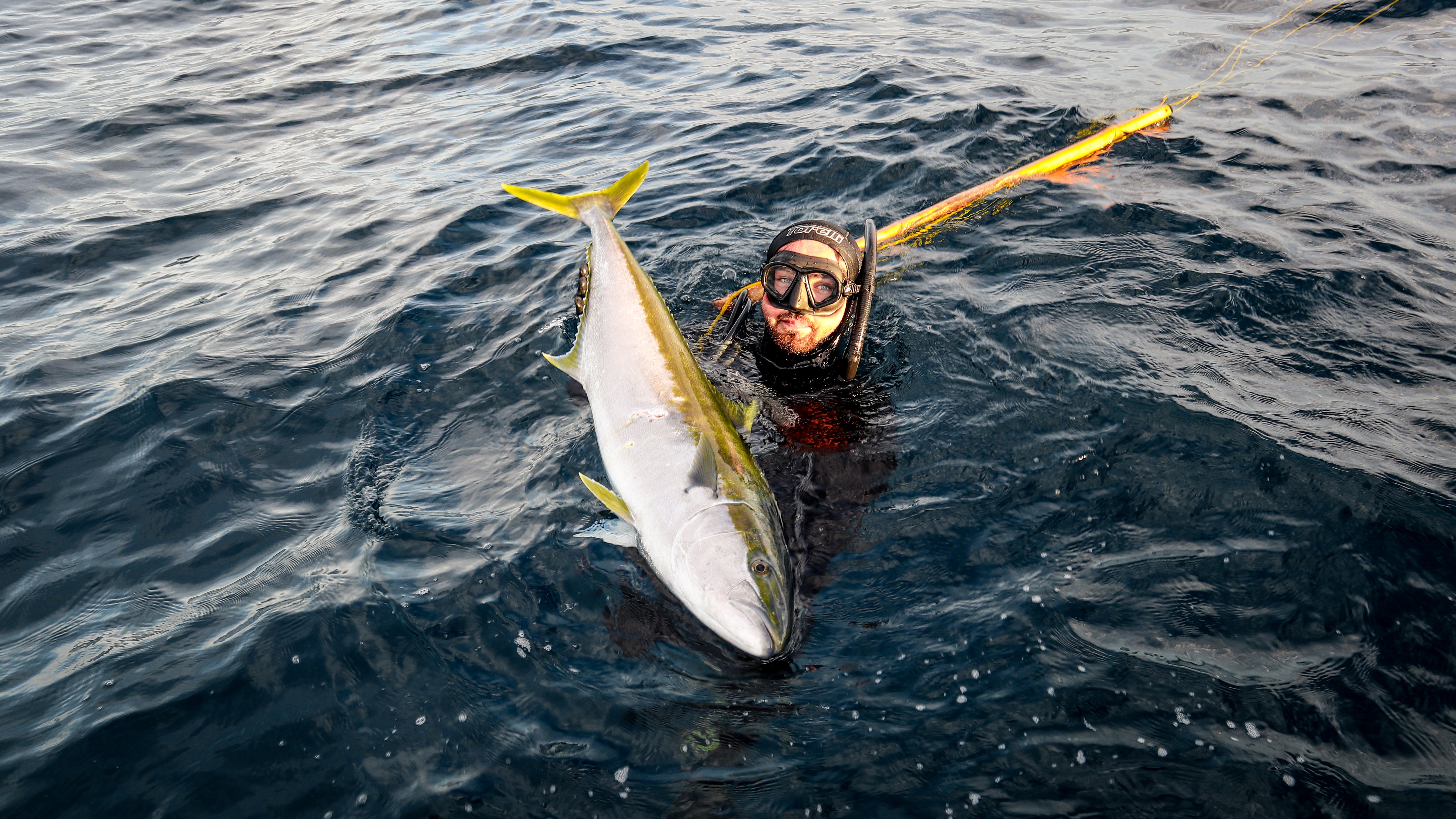 Pat holding 20kg Kingfish shot off seal rocks with the bombora 130RH Pelagic